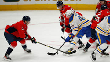Sep 25, 2022; Washington, District of Columbia, USA; Buffalo Sabres center Tyson Kozak (48) battles for the puck with Washington Capitals defenseman Dru Krebs (51) and Washington Capitals left wing Alex Ovechkin (8) during the second period at Capital One Arena. Mandatory Credit: Amber Searls-USA TODAY Sports