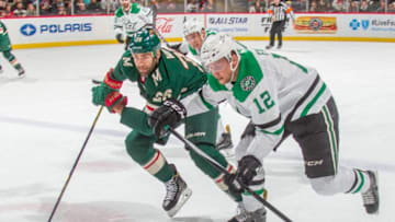 ST. PAUL, MN - DECEMBER 27: Daniel Winnik #26 of the Minnesota Wild and Radek Faksa #12 of the Dallas Stars skate to the puck during the game at the Xcel Energy Center on December 27, 2017 in St. Paul, Minnesota. (Photo by Bruce Kluckhohn/NHLI via Getty Images)