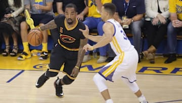 June 19, 2016; Oakland, CA, USA; Cleveland Cavaliers guard J.R. Smith (5) moves the ball against Golden State Warriors guard Stephen Curry (30) in the first half in game seven of the NBA Finals at Oracle Arena. Mandatory Credit: Kelley L Cox-USA TODAY Sports