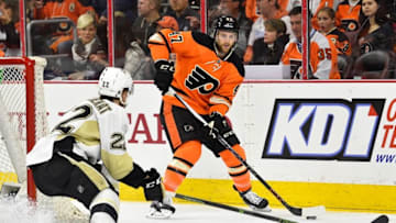 Apr 9, 2016; Philadelphia, PA, USA; Philadelphia Flyers defenseman Andrew MacDonald (47) looks to pass the puck against Pittsburgh Penguins center Kael Mouillierat (22) during the first period at Wells Fargo Center. Mandatory Credit: Derik Hamilton-USA TODAY Sports