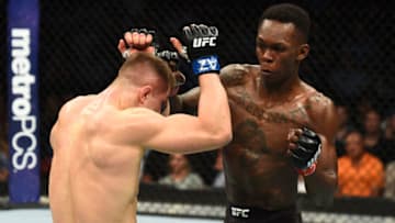 GLENDALE, AZ - APRIL 14: (R-L) Israel Adesanya of Nigeria punches Marvin Vettori of Italy in their middleweight fight during the UFC Fight Night event at the Gila Rivera Arena on April 14, 2018 in Glendale, Arizona. (Photo by Josh Hedges/Zuffa LLC/Zuffa LLC via Getty Images)