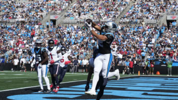 Oct 29, 2023; Charlotte, North Carolina, USA; Carolina Panthers tight end Tommy Tremble (82) catches a touchdown pass as Houston Texans linebacker Blake Cashman (53) defends in the second quarter at Bank of America Stadium. Mandatory Credit: Bob Donnan-USA TODAY Sports