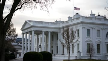 WASHINGTON, DC - MARCH 19: The American flag flies at half-staff at the White House on March 19, 2021 in Washington, DC. President Joe Biden issued a proclamation for U.S. flags on federal buildings to be lowered to half-staff through Monday to mark the recent shooting that killed eight people in Georgia. (Photo by Drew Angerer/Getty Images)