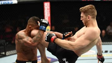 LAS VEGAS, NV - JULY 07: Dan Hooker knees Gilbert Burns in their lightweight fight during the UFC 226 event inside T-Mobile Arena on July 7, 2018 in Las Vegas, Nevada. (Photo by Josh Hedges/Zuffa LLC/Zuffa LLC via Getty Images)