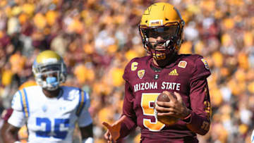 TEMPE, AZ - NOVEMBER 10: Quarterback Manny Wilkins #5 of the Arizona State Sun Devils the the football 13 yards to score a touchdown in the firt half against the UCLA Bruins at Sun Devil Stadium on November 10, 2018 in Tempe, Arizona. (Photo by Jennifer Stewart/Getty Images)