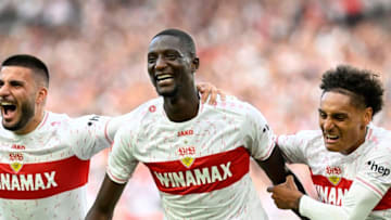 Stuttgart's Guinean forward #09 Serhou Guirassy (C) celebrates with Stuttgart's German forward #26 Deniz Undav (L) and Stuttgart's French midfielder #08 Enzo Millot (R) after he scored the 3-1 goal during the German first division Bundesliga football match between VfB Stuttgart and VfL Wolfsburg in Stuttgart, southern Germany on October 7, 2023. (Photo by THOMAS KIENZLE / AFP) / DFL REGULATIONS PROHIBIT ANY USE OF PHOTOGRAPHS AS IMAGE SEQUENCES AND/OR QUASI-VIDEO (Photo by THOMAS KIENZLE/AFP via Getty Images)