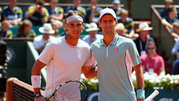 PARIS, FRANCE - JUNE 07: Rafael Nadal of Spain poses at the net with Novak Djokovic of Serbia before their men's singles semi-final match on day thirteen of the French Open at Roland Garros on June 7, 2013 in Paris, France. (Photo by Julian Finney/Getty Images)