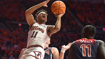 Dec 11, 2021; Champaign, Illinois, USA; Illinois Fighting Illini guard Alfonso Plummer (11) shoots the ball over Arizona Wildcats center Oumar Ballo (11) during the first half at State Farm Center. Mandatory Credit: Ron Johnson-USA TODAY Sports