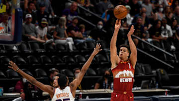 Michael Porter Jr, Denver Nuggets shoots over Mikal Bridges, Phoenix Suns in Game 4 of the Western Conference second-round series at Ball Arena. (Photo by Dustin Bradford/Getty Images)