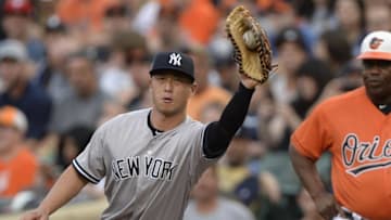 Jun 4, 2016; Baltimore, MD, USA; New York Yankees first baseman Rob Refsnyder (38) stretches for the ball for the force out of Baltimore Orioles center fielder Adam Jones (not pictured) during the first inning at Oriole Park at Camden Yards. Mandatory Credit: Tommy Gilligan-USA TODAY Sports