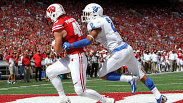MADISON, WI - SEPTEMBER 17: Kyle Penniston #49 of the Wisconsin Badgers scores a touchdown while being guarded by Bobby Baker #2 of the Georgia State Panthers in the fourth quarter at Camp Randall Stadium on September 17, 2016 in Madison, Wisconsin. (Photo by Dylan Buell/Getty Images)