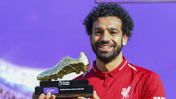 LIVERPOOL, ENGLAND - MAY 13: Mohamed Salah of Liverpool poses for a photo with his Premier League Golden Boot Award after the Premier League match between Liverpool and Brighton and Hove Albion at Anfield on May 13, 2018 in Liverpool, England. (Photo by Michael Regan/Getty Images)