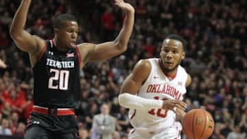 Feb 17, 2016; Lubbock, TX, USA; Texas Tech Red Raiders guard Toddrick Gotcher (20) tries to block Oklahoma Sooners guard Jordan Woodard (20) in the first half at United Supermarkets Arena. Texas Tech defeated Oklahoma 65-63. Mandatory Credit: Michael C. Johnson-USA TODAY Sports
