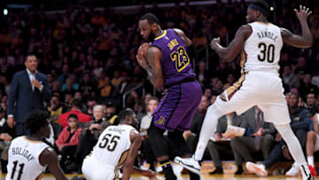 LOS ANGELES, CALIFORNIA - DECEMBER 21: LeBron James #23 of the Los Angeles Lakers comes up with a rebound in front of Jrue Holiday #11, E'Twaun Moore #55 and Julius Randle #30 of the New Orleans Pelicans during a 112-104 Laker win at Staples Center on December 21, 2018 in Los Angeles, California. NOTE TO USER: User expressly acknowledges and agrees that, by downloading and or using this photograph, User is consenting to the terms and conditions of the Getty Images License Agreement. (Photo by Harry How/Getty Images)