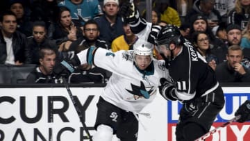 LOS ANGELES, CA - MARCH 21: Anze Kopitar #11 of the Los Angeles Kings and Brenden Dillon #4 of the San Jose Sharks battle for the puck during the third period of the game at STAPLES Center on March 21, 2019 in Los Angeles, California. (Photo by Adam Pantozzi/NHLI via Getty Images)