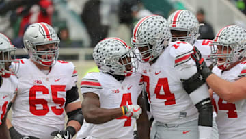 EAST LANSING, MI - NOVEMBER 19: Curtis Samuel #4 of the Ohio State Buckeyes celebrates a touchdown with his teammates during the first quarter of the game against the Michigan State Spartans at Spartan Stadium on November 19, 2016 in East Lansing, Michigan. (Photo by Leon Halip/Getty Images)