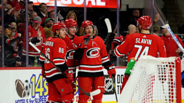 RALEIGH, NC - JANUARY 21: Justin Williams #14 of the Carolina Hurricanes scores his 2nd goal of the night and celebrates with teammates Andrei Svechnikov #37 Teuvo Teravaien #86 and Jaccob Slavin #74 during an NHL game against the Winnipeg Jets on January 21, 2020 at PNC Arena in Raleigh, North Carolina. (Photo by Gregg Forwerck/NHLI via Getty Images)