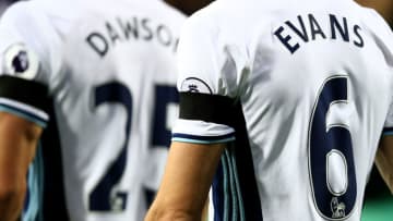 WEST BROMWICH, ENGLAND - DECEMBER 03: Jonny Evans of West Bromwich Albion wears a black armband to remember the victims of the plane crash involving the Brazilian club Chapecoense prior to the Premier League match between West Bromwich Albion and Watford at The Hawthorns on December 3, 2016 in West Bromwich, England. (Photo by Jan Kruger/Getty Images)