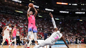 Kyle Kuzma #33 of the Washington Wizards shoots a jump shot while being defended by Bam Adebayo #13 of the Miami Heat (Photo by Eric Espada/Getty Images)