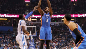 Jan 18, 2015; Orlando, FL, USA; Oklahoma City Thunder forward Serge Ibaka (9) shoots over Orlando Magic guard Victor Oladipo (5) during the first quarter at Amway Center. Mandatory Credit: Kim Klement-USA TODAY Sports