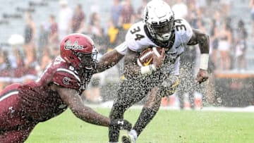 COLUMBIA, SC - OCTOBER 06: Running back Larry Rountree III #34 of the Missouri Tigers evades defensive lineman Rick Sandidge #90 of the South Carolina Gamecocks during the football game at Williams-Brice Stadium on October 6, 2018 in Columbia, South Carolina. (Photo by Mike Comer/Getty Images)
