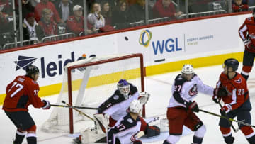 WASHINGTON, DC - NOVEMBER 09: Columbus Blue Jackets goaltender Sergei Bobrovsky (72) deflects a shot in the air as Washington Capitals right wing T.J. Oshie (77) amd Washington Capitals center Lars Eller (20) follow the flight on November 9, 2018, at the Capital One Arena in Washington, D.C. (Photo by Mark Goldman/Icon Sportswire via Getty Images)