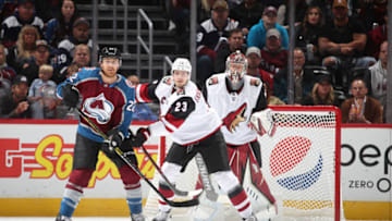 DENVER, COLORADO - OCTOBER 12: Goaltender Antti Raanta #32 of the Arizona Coyotes stands behind teammate Oliver Ekman-Larsson #23 and Colin Wilson #22 of the Colorado Avalanche at the Pepsi Center on October 12, 2019 in Denver, Colorado.