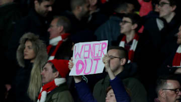 LONDON, ENGLAND - MARCH 07: A fan holds up a protest sign saying 'Wenger Out' during the UEFA Champions League Round of 16 second leg match between Arsenal FC and FC Bayern Muenchen at Emirates Stadium on March 7, 2017 in London, United Kingdom. (Photo by Mitchell Gunn/Getty Images)