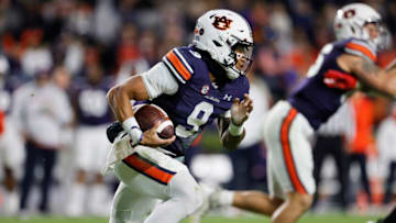 Auburn footballNov 19, 2022; Auburn, Alabama, USA; Auburn Tigers quarterback Robby Ashford (9) scrambles for yardage during the third quarter against the Western Kentucky Hilltoppers at Jordan-Hare Stadium. Mandatory Credit: John Reed-USA TODAY Sports