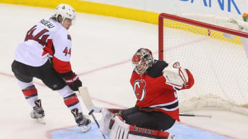Jan 21, 2016; Newark, NJ, USA; New Jersey Devils goalie Cory Schneider (35) makes a save on Ottawa Senators center Jean-Gabriel Pageau (44) during the third period at Prudential Center. The Devils defeated the Senators 6-3. Mandatory Credit: Ed Mulholland-USA TODAY Sports