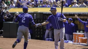 Apr 16, 2016; Oakland, CA, USA; Kansas City Royals shortstop Alcides Escobar (2) congratulated by teammates after scoring the first run of the game against the Oakland Athletics in the fist inning at The Coliseum. Mandatory Credit: Neville E. Guard-USA TODAY Sports