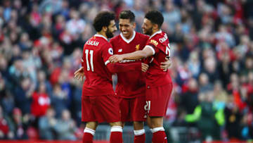 LIVERPOOL, ENGLAND - APRIL 14: Roberto Firmino of Liverpool celebrates after scoring his sides third goal with Mohamed Salah ofLiverpool and Alex Oxlade-Chamberlain of Liverpool during the Premier League match between Liverpool and AFC Bournemouth at Anfield on April 14, 2018 in Liverpool, England. (Photo by Clive Brunskill/Getty Images)