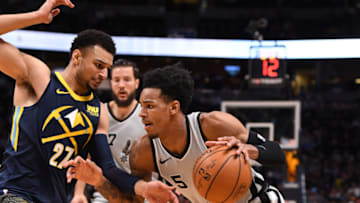 DENVER, CO - FEBRUARY 13: San Antonio Spurs guard Dejounte Murray (5) drives on Denver Nuggets guard Jamal Murray (27) during the first quarter on February 13, 2018 at Pepsi Center. (Photo by John Leyba/The Denver Post via Getty Images)