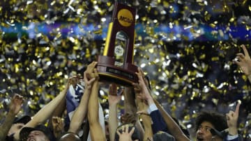 Apr 3, 2023; Houston, TX, USA; Connecticut Huskies players celebrate after defeating the San Diego State Aztecs in the national championship game of the 2023 NCAA Tournament at NRG Stadium. Mandatory Credit: Bob Donnan-USA TODAY Sports