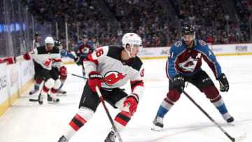 DENVER, COLORADO - DECEMBER 13: Jack Hughes #86 of the New Jersey Devils advances the puck against Pierre-Edauard Bellemare #41` of the Colorado Avalanche in the first period at the Pepsi Center on December 13, 2019 in Denver, Colorado. (Photo by Matthew Stockman/Getty Images)