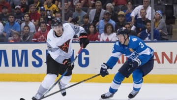 Sep 18, 2016; Toronto, Ontario, Canada; Team North America Center Mark Scheifele (55) battles for a puck with Team Finland Defenceman Olli Maatta (3) during the first period in preliminary round play in the 2016 World Cup of Hockey at Air Canada Centre. Mandatory Credit: Nick Turchiaro-USA TODAY Sports