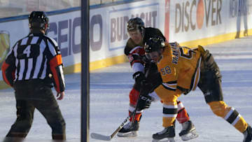 Feb 21, 2021; Stateline, Nevada, USA; Boston Bruins defenseman Urho Vaakanainen (58) battles for the puck against Philadelphia Flyers right wing Nicolas Aube-Kubel (62) during the first period in a NHL Outdoors hockey game at Lake Tahoe. Mandatory Credit: Kirby Lee-USA TODAY Sports