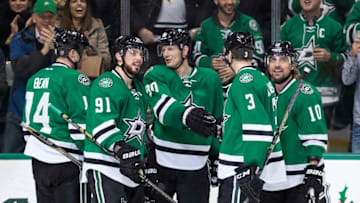 Nov 27, 2015; Dallas, TX, USA; Dallas Stars left wing Jamie Benn (14) and center Tyler Seguin (91) and center Jason Spezza (90) and defenseman John Klingberg (3) and left wing Patrick Sharp (10) celebrate during the game against the Vancouver Canucks at the American Airlines Center. The Stars defeat the Canucks 3-2 in the overtime shootout. Mandatory Credit: Jerome Miron-USA TODAY Sports