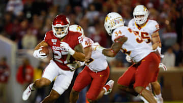 NORMAN, OK - NOVEMBER 9: Fullback Jeremiah Hall #27 of the Oklahoma Sooners takes a catch for first down against linebackers Marcel Spears Jr. #42 and O'Rien Vance #34 of the Iowa State Cyclones on November 9, 2019 at Gaylord Family Oklahoma Memorial Stadium in Norman, Oklahoma. OU held on to win 42-41. (Photo by Brian Bahr/Getty Images)