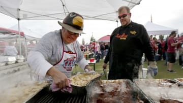 Jan 16, 2016; Glendale, AZ, USA; Arizona Cardinals fans Jeff Muecke (left) and Mark Ludvigsen prepare food as they tailgate before a NFC Divisional round playoff game against the Green Bay Packers at University of Phoenix Stadium. Mandatory Credit: William Glasheen/The Post-Crescent via USA TODAY Sports