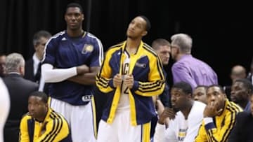 Apr 28, 2014; Indianapolis, IN, USA; Indiana Pacers bench (left to right) Donald Sloan, Ian Mahinmi, Evan Turner, Roy Hibbert, and Rasual Butler look on as they lose to the Atlanta Hawks in game five of the first round of the 2014 NBA Playoffs at Bankers Life Fieldhouse. Atlanta defeats Indiana 107-97. Mandatory Credit: Brian Spurlock-USA TODAY Sports
