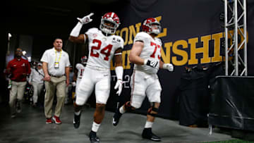 ATLANTA, GA - JANUARY 08: Brian Robinson Jr. #24 of the Alabama Crimson Tide walks out of the tunnel during warm ups with Jonah Williams #73 during warm ups prior to the game against the Georgia Bulldogs in the CFP National Championship presented by AT&T at Mercedes-Benz Stadium on January 8, 2018 in Atlanta, Georgia. (Photo by Jamie Squire/Getty Images)