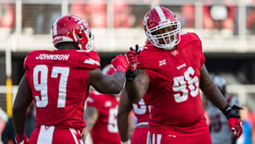 WASHINGTON, DC - FEBRUARY 15: Jay Bromley #96 of the DC Defenders celebrates with Anthony Johnson #97 during the second half of the XFL game against the NY Guardians at Audi Field on February 15, 2020 in Washington, DC. (Photo by Scott Taetsch/Getty Images)