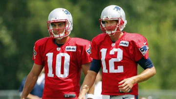 Aug 6, 2015; Foxborough, MA, USA; New England Patriots quarterback Tom Brady (12) and quarterback Jimmy Garoppolo (10) look on during training camp at Gillette Stadium. Mandatory Credit: Winslow Townson-USA TODAY Sports