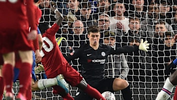 Chelsea's Spanish goalkeeper Kepa Arrizabalaga (C) saves a shot from Liverpool's Senegalese striker Sadio Mane (L) during the English FA Cup fifth round football match between Chelsea and Liverpool at Stamford Bridge in London on March 3, 2020. (Photo by Glyn KIRK / AFP) / RESTRICTED TO EDITORIAL USE. No use with unauthorized audio, video, data, fixture lists, club/league logos or 'live' services. Online in-match use limited to 120 images. An additional 40 images may be used in extra time. No video emulation. Social media in-match use limited to 120 images. An additional 40 images may be used in extra time. No use in betting publications, games or single club/league/player publications. / (Photo by GLYN KIRK/AFP via Getty Images)