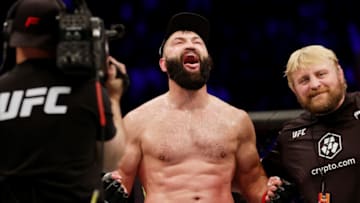 HOUSTON, TEXAS - FEBRUARY 12: Andrei Arlovski (C) of Belarus reacts after winning his heavyweight fight against Jared Vanderaa via split decision during UFC 271 at Toyota Center on February 12, 2022 in Houston, Texas. (Photo by Carmen Mandato/Getty Images)