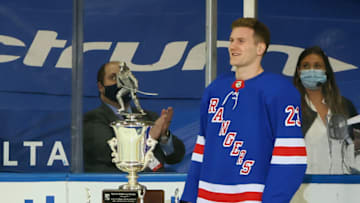 NEW YORK, NEW YORK - APRIL 29: The Steven McDonald Extra Effort Award is presented to Adam Fox #23 of the New York Rangers prior to the game against the New York Islanders at Madison Square Garden on April 29, 2021 in New York City. (Photo by Bruce Bennett/Getty Images)