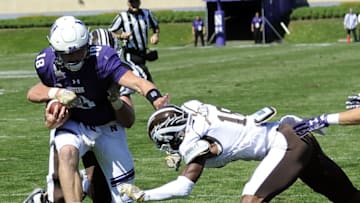 EVANSTON, IL- SEPTEMBER 03: Clayton Thorson #18 of the Northwestern Wildcats is tackled by Sam Beal #18 of the Western Michigan Broncos during the second half on September 3, 2016 at Ryan Field in Evanston, Illinois. the Western Michigan Broncos won 22-21. (Photo by David Banks/Getty Images)