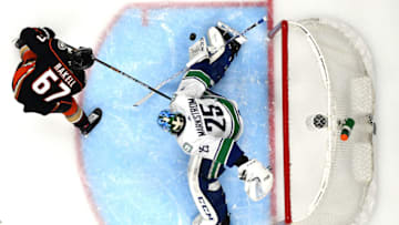 ANAHEIM, CALIFORNIA - NOVEMBER 01: Jacob Markstrom #25 of the Vancouver Canucks makes a save on Rickard Rakell #67 of the Anaheim Ducks during the third period in a 2-1 overtime Ducks win at Honda Center on November 01, 2019 in Anaheim, California. (Photo by Harry How/Getty Images)