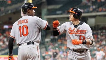 May 24, 2016; Houston, TX, USA; Baltimore Orioles center fielder Adam Jones (10) celebrates short stop Manny Machado (13) home run against the Houston Astros in the sixth inning at Minute Maid Park. Mandatory Credit: Thomas B. Shea-USA TODAY Sports
